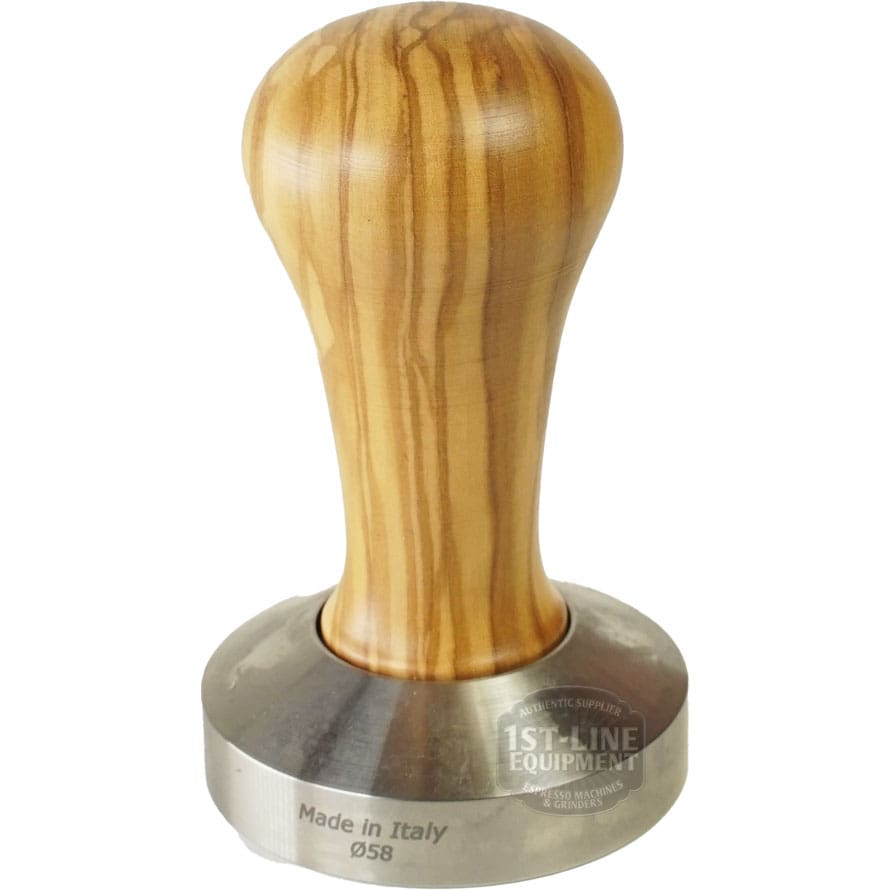 The 1st-line Olive Wood 58mm Espresso Coffee Tamper features an olive wood handle, a metal base engraved Made in Italy Ø58, and an upright design with a faint 1st-Line Equipment logo visible on the base. © 2025 1st-line.com