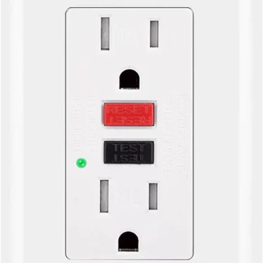 A white GFI electrical outlet with two sockets, a red RESET button, a black TEST button, and a small green indicator light on the left side. This Ground Fault Interrupt Circuit protects against electrical shocks. © 2025 1st-line.com