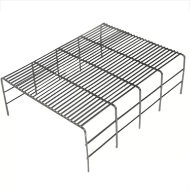 The Elektra 04622082 Drip Tray Grate is a rectangular black metal grate with closely spaced wires and raised legs, perfect for versatile use such as cooling baked goods. It stands elevated above a white background. © 2025 1st-line.com