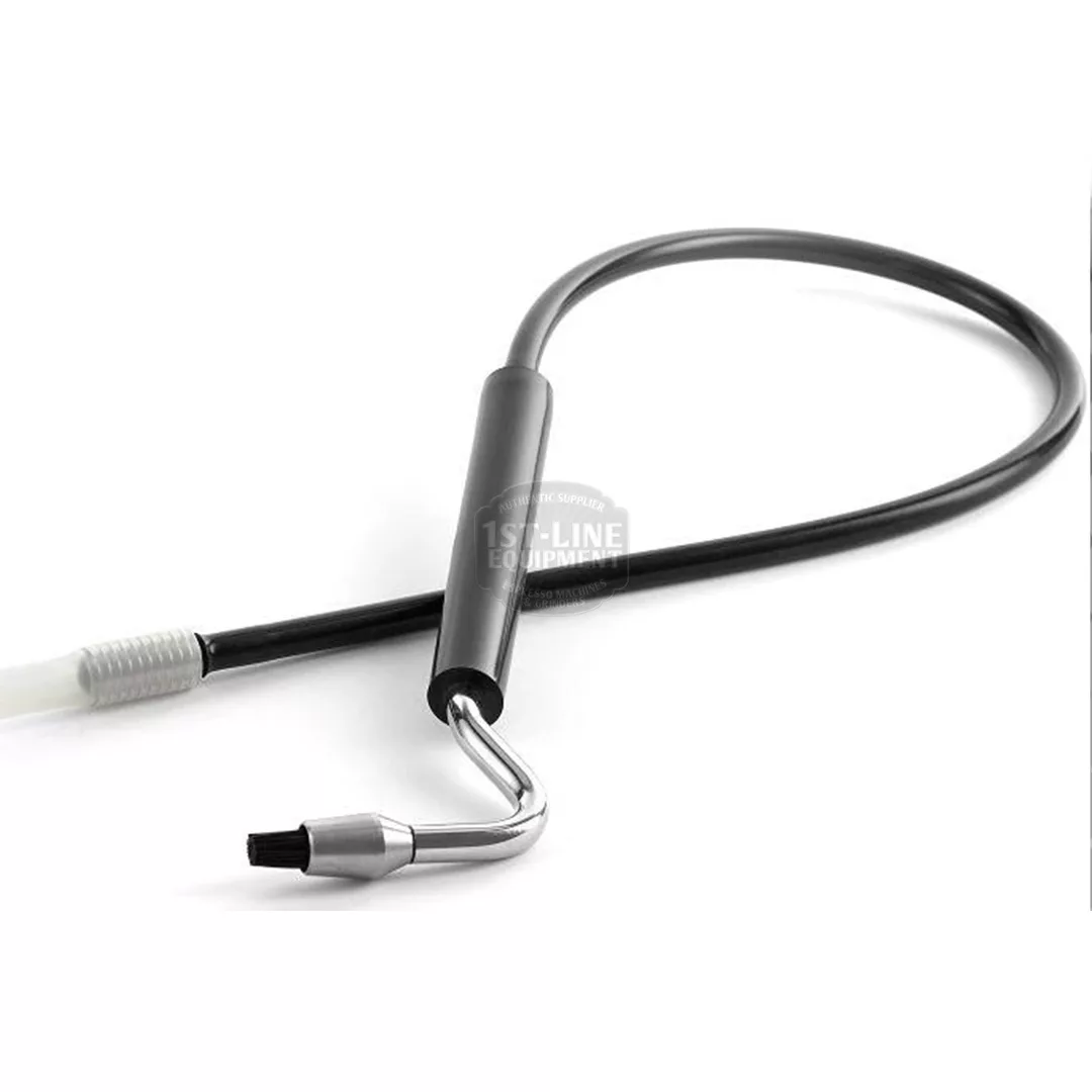 A close-up of the DISCONTINUED - Joe Frex Espresso Steam Brush, showing its long black flexible hose and small brush head with a metal tip, designed for cleaning espresso machine steam wands. © 2025 1st-line.com
