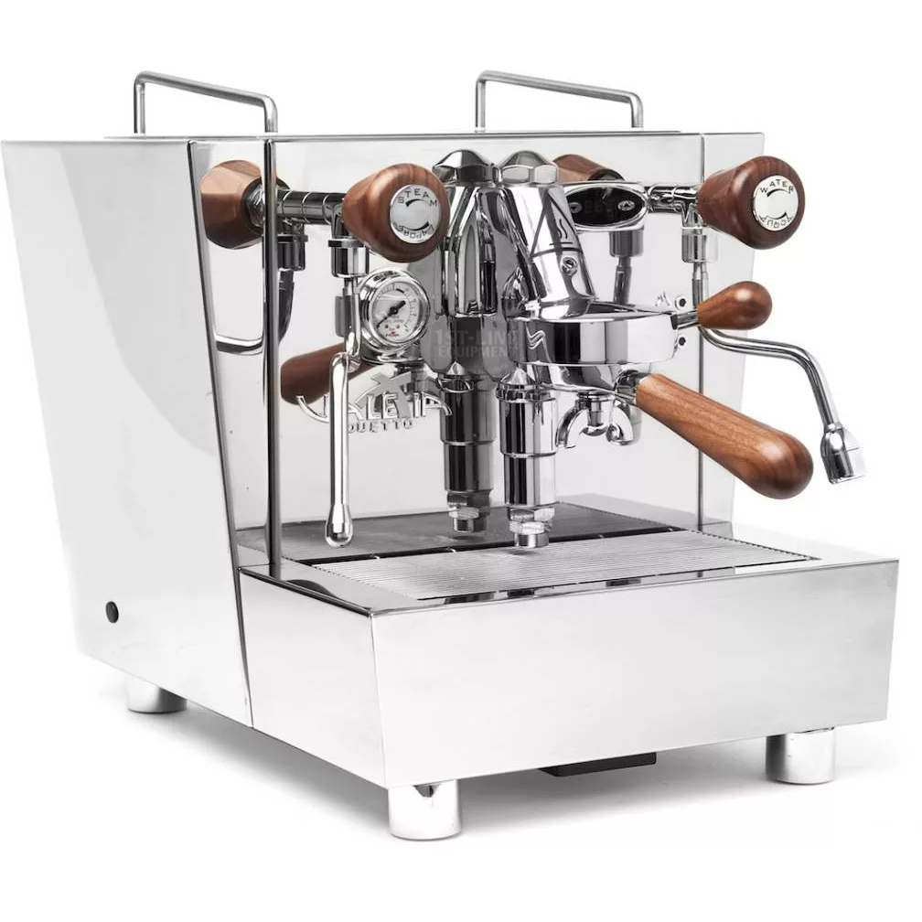 A DISCONTINUED Izzo Valexia HX Espresso Machine with stainless steel body, wooden handles and knobs, pressure gauges, and a steam wand sits elegantly on a flat surface. © 2025 1st-line.com
