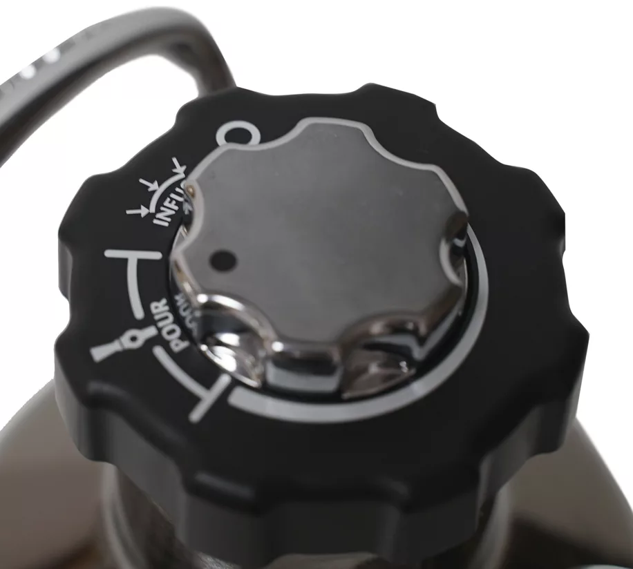 Close-up of the black and silver twist cap on the DISCONTINUED GrowlerWerks uKeg Nitro Cold Brew Coffee Maker with N2O, showing labeled pour and infuse settings with arrows to indicate turn directions. © 2025 1st-line.com