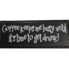 A black wooden sign with playful white text: Ill start working when the coffee does. Perfect office decor for coffee lovers who enjoy witty quotes. © 2025 1st-line.com
