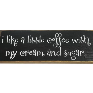 A discontinued black wooden sign with white whimsical text: Give me coffee to change the things I can...—a playful coffee quote for your space. © 2025 1st-line.com