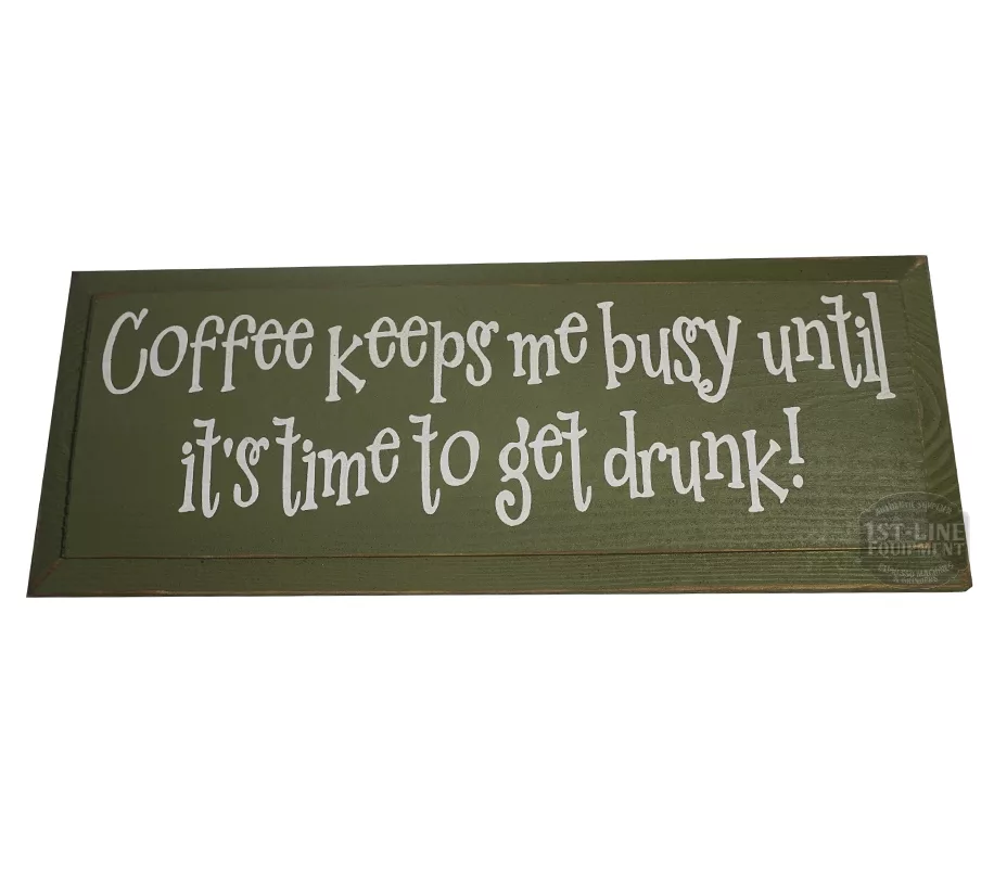 A green wooden sign with playful white text: Ill start working when the coffee does. The perfect coffee quote for adding work motivation and humor to your space. © 2025 1st-line.com