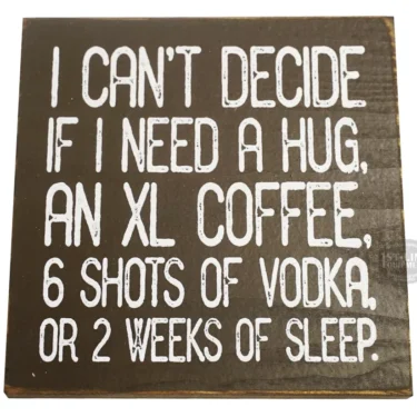 The I cant decide if I need a hug, an XL coffee... Sign features bold white text that says: I cant decide if I need a hug, an XL coffee, 6 shots of vodka, or 2 weeks of sleep. © 2025 1st-line.com