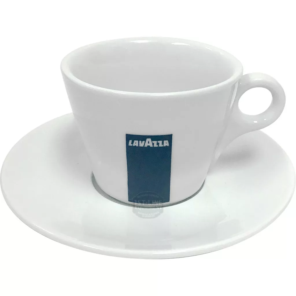 The Lavazza Cappuccino Cup & Saucer set includes a white ceramic cup with a handle, featuring a vertical blue rectangle and bold white Lavazza lettering, resting on its matching saucer. © 2025 1st-line.com