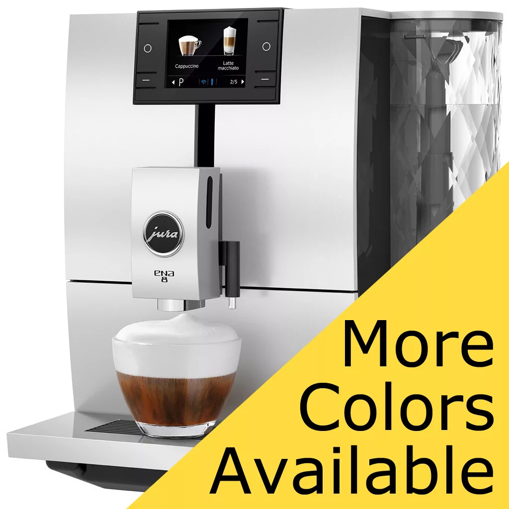 A silver DISCONTINUED Jura ENA8 Super Automatic Espresso Machine brews a cappuccino into a glass cup. A large yellow triangle in the bottom right corner says More Colors Available. © 2025 1st-line.com