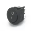 The Lelit 9600052 LED Switch for Switch Assembly is a black round rocker switch with white I/O symbols, designed for turning electronics on or off—ideal for LED switch assembly—shown against a white background. © 2025 1st-line.com