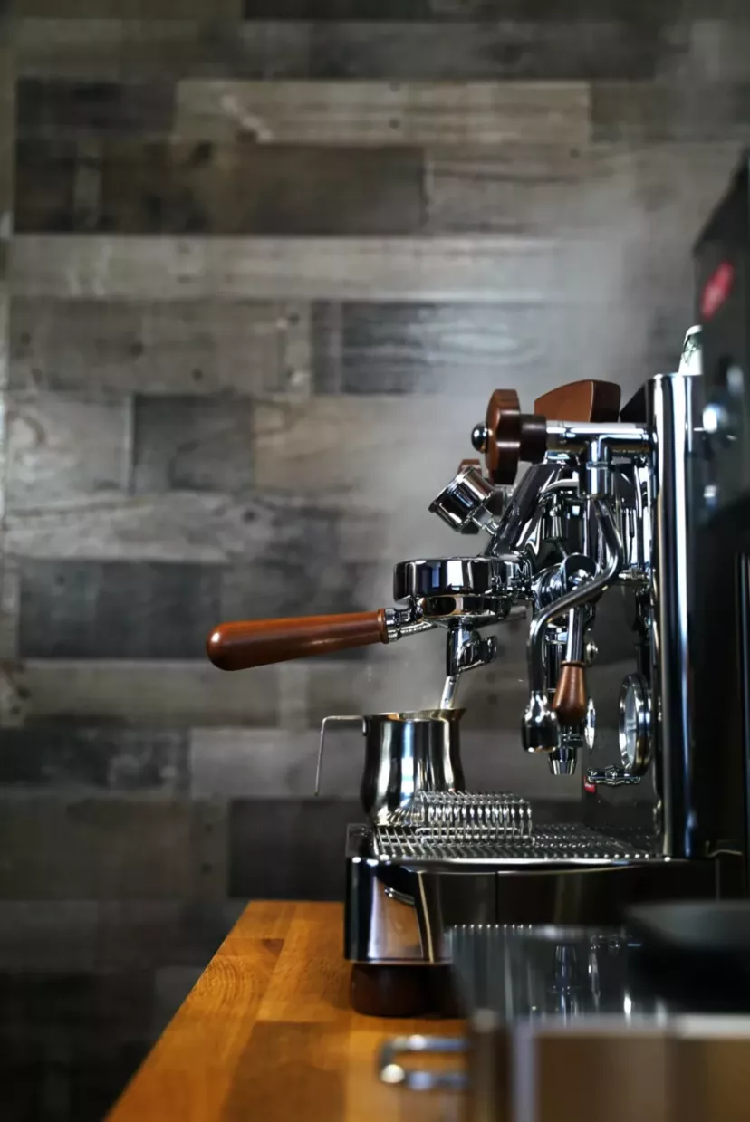 A (SOLD) SIDEWALK SALE Lelit Bianca Dual Boiler Espresso Machine V2 PID w/ Manual Brew Pressure Profiling DEMO MODEL with wood accents sits on a wood countertop, metal frothing pitcher under the steam wand, ready for precise pressure profiling. © 2025 1st-line.com