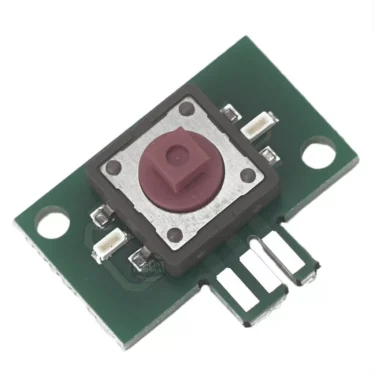 A close-up of the Lelit 9600034 Switch with Double LED for Switch Assembly displays an electronic tactile push button on a compact green circuit board, featuring double LEDs, two mounting holes, and three connector pins. © 2025 1st-line.com