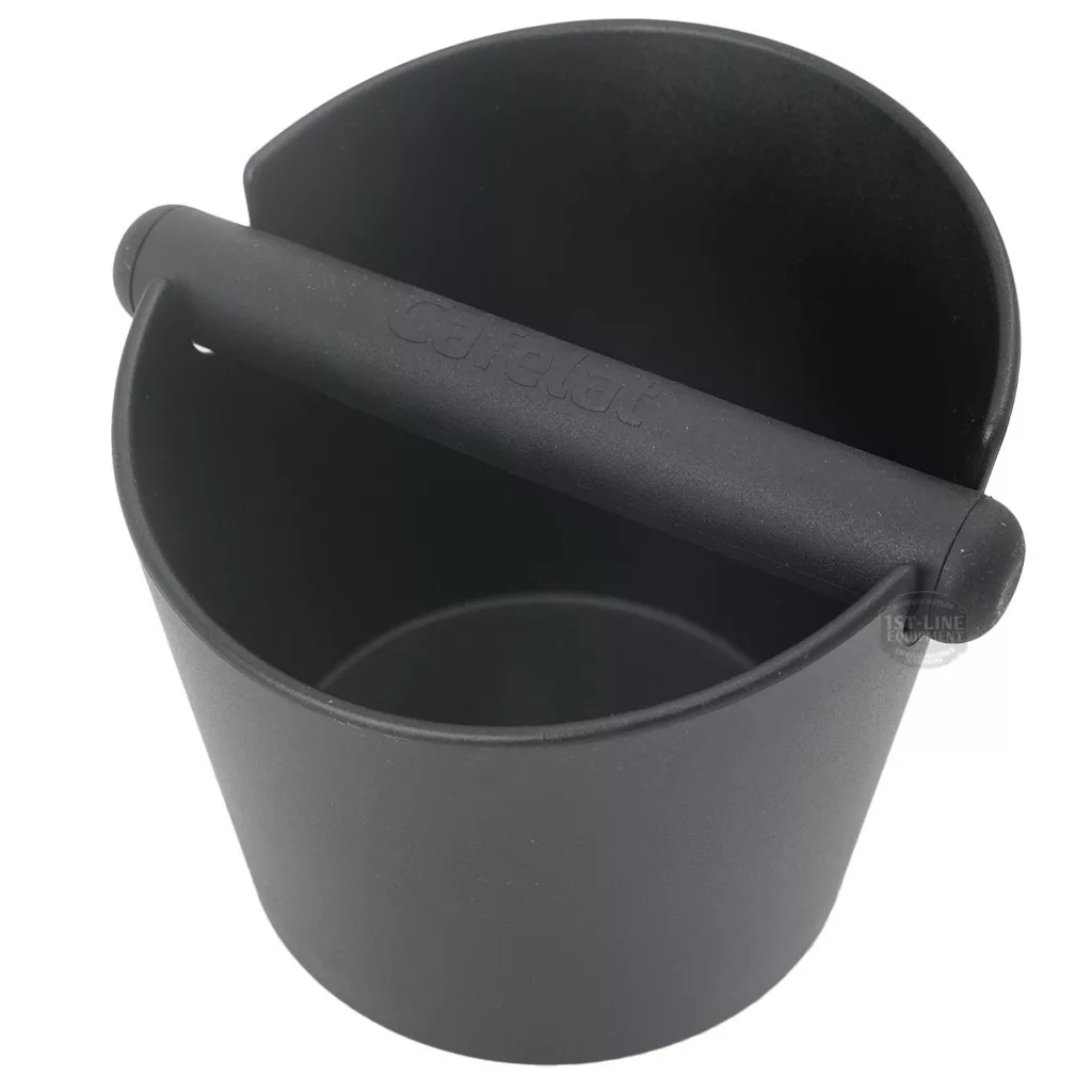 The DISCONTINUED Cafelat Large Tubbi Knockbox in Black is a round, sturdy plastic knockbox with a horizontal bar for knocking out used coffee grounds. © 2025 1st-line.com