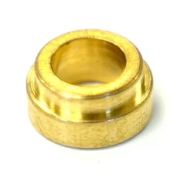 The Lelit 2200012 Spring Holder for Steam/Hot Water Valve is a small, gold-colored metal bushing with a wide outer rim and central hole, shown against a white background. © 2025 1st-line.com