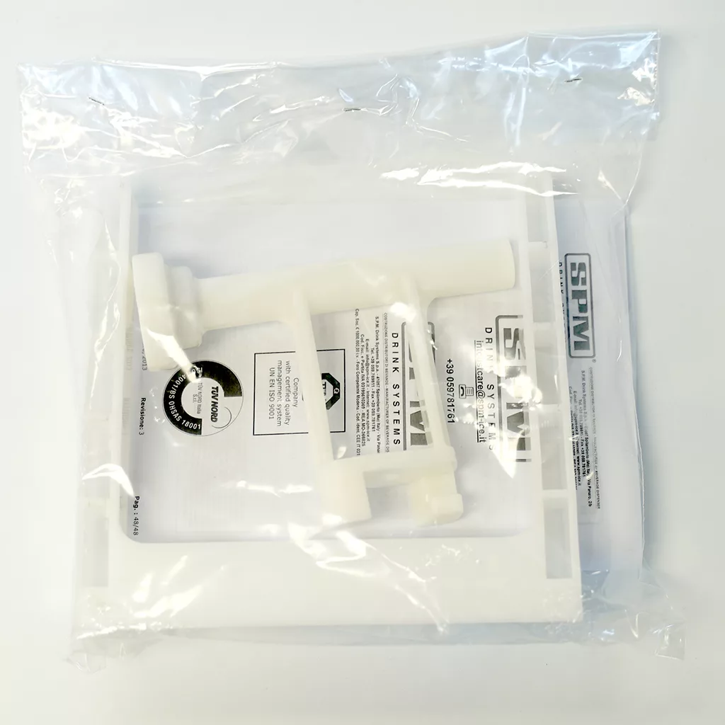 The SPM Conversion Kit for GT Touch to GT LAB Configuration, a white plastic device with multiple components, comes sealed in a clear bag with paper instructions and the kit’s logo visible through the packaging. © 2025 1st-line.com