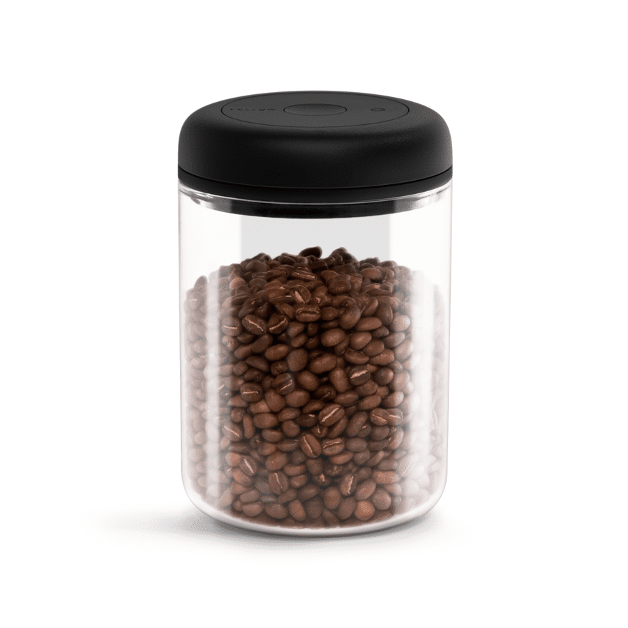 A DISCONTINUED Fellow Atmos Vacuum Canister 1.2 L in clear glass with a black lid holds roasted coffee beans, shown against a white background. © 2025 1st-line.com