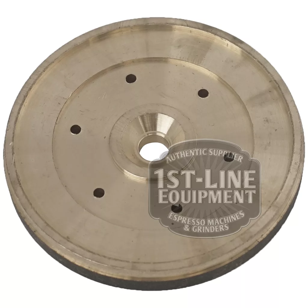 The BE.206 SHOWER HOLDER is a circular metal grinder plate with multiple small holes and a central opening, branded 1st-Line Equipment, designed for use in espresso machines and grinders. © 2025 1st-line.com