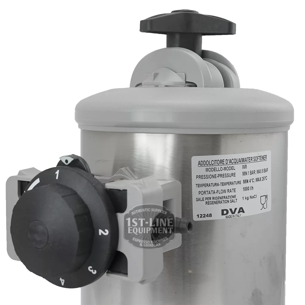 The Pasquini Livia G4 Brain Unit 9.5.17.64G is a stainless steel water softener with a black control dial and labeled pressure gauge, featuring branding stickers—ideal for pairing with the Livia G4 espresso machine. © 2025 1st-line.com