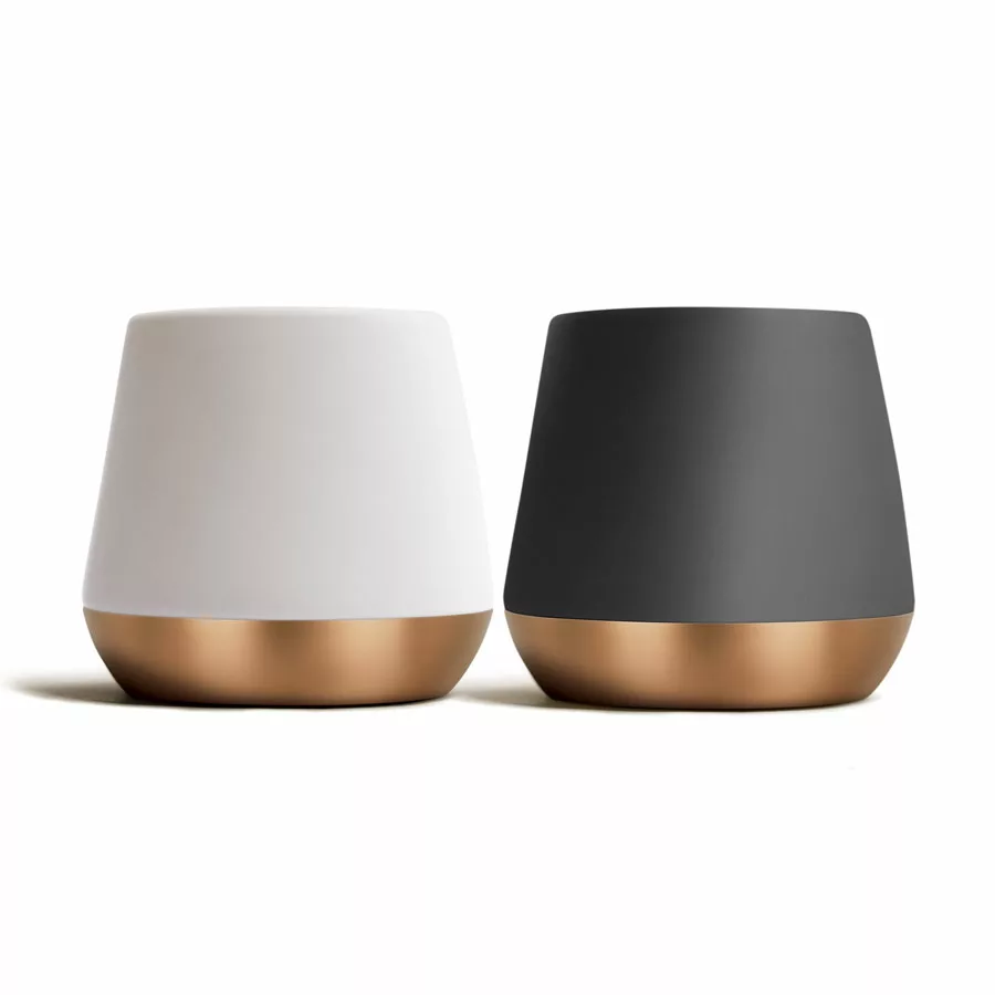 Two modern, cylindrical DISCONTINUED Fellow Big Jo Double Wall Ceramic Mugs (12 oz) with gold bases—one matte white, one matte black—stand side by side on a white background. Both feature smooth, minimalistic designs. © 2025 1st-line.com