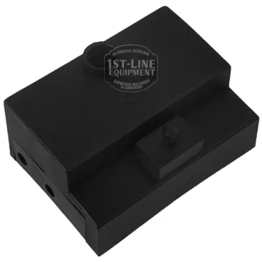 A black rectangular plastic component with a raised section and cylindrical protrusions, labeled 1st-Line Equipment at the top center. Perfect as a BRASILIA OUTLET TANK replacement. The background is white. © 2025 1st-line.com