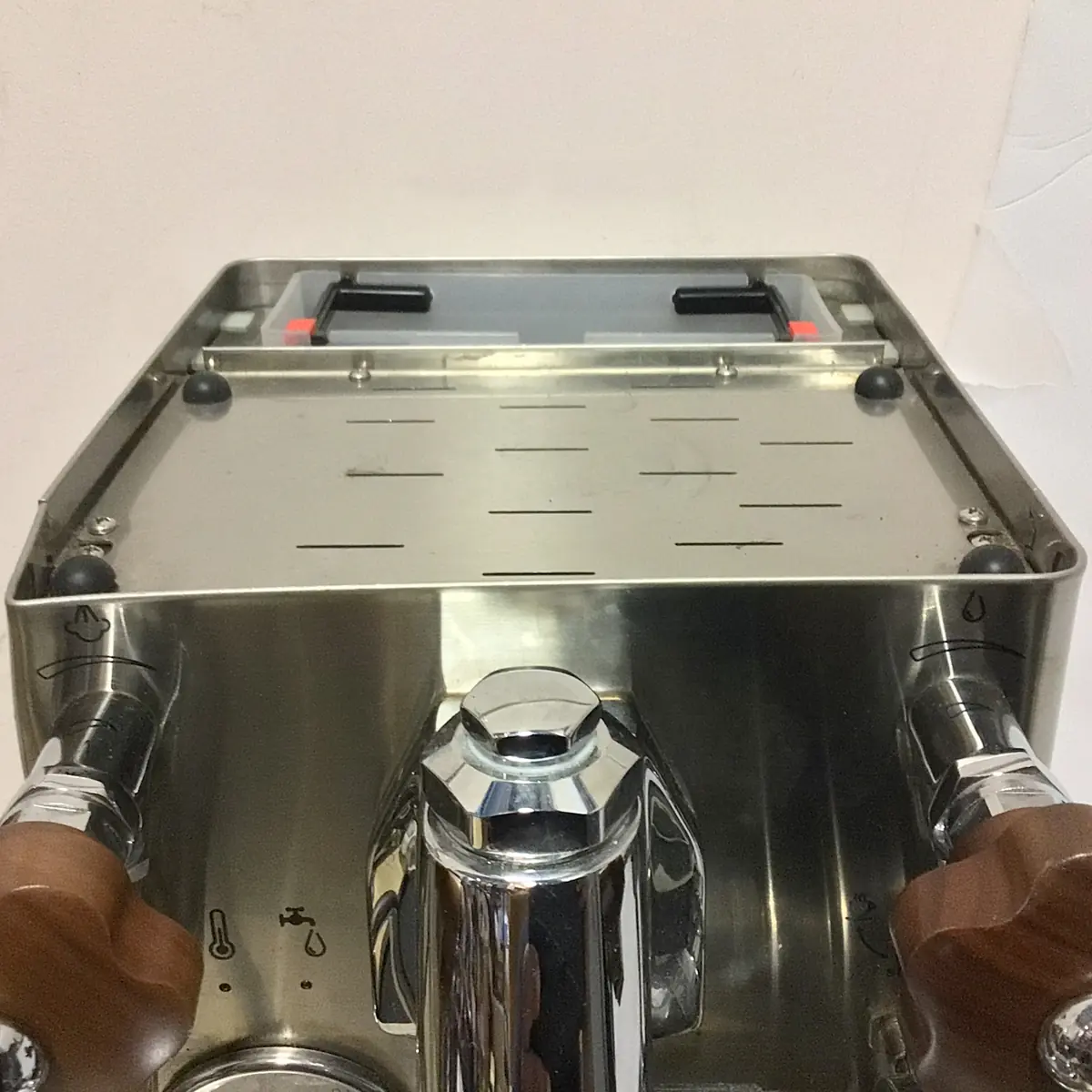 A close-up of the SOLD SIDEWALK SALE - Lelit Mara X PL62X HX Espresso Machine (used) (E213), featuring wooden handles and a shiny stainless steel finish with a slotted flat top tray, set against a plain white background.