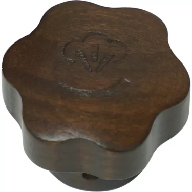 The La Pavoni Assembly Wood Plug is a dark wooden knob with a flower-shaped outline and an engraved cloud design on top, ideal for your La Pavoni setup. © 2025 1st-line.com