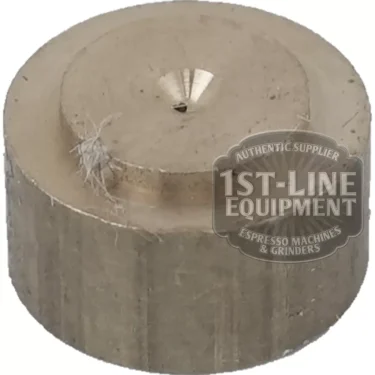 A round, metallic C..243 GIGLEUR/GICLEUR part features a small conical indentation on top, some fibers on its surface, and is stamped with the 1st-Line Equipment Espresso Machines & Grinders logo. © 2025 1st-line.com