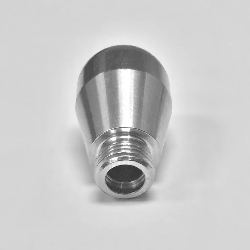 A smooth, metallic cylindrical object with a threaded end is shown against a white background. This reflective component is the Lelit 2200057 2-Hole Steam Wand Tip. © 2025 1st-line.com