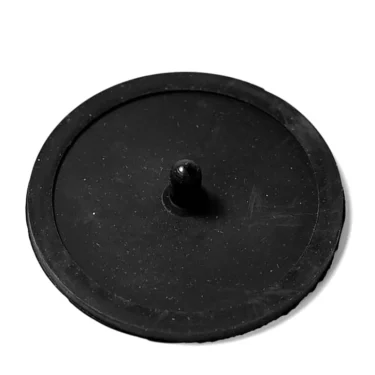 The Cimbali 57/58mm Rubber Blind Filter Insert is a round, flat black filter with a central peg, designed for Cimbali machines and shown on a white background. © 2025 1st-line.com