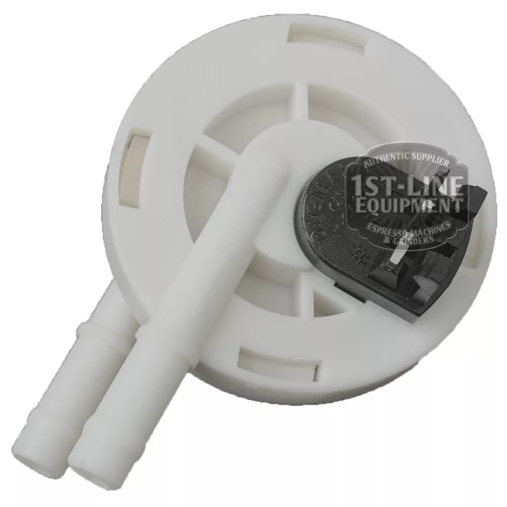 The DIGMESA I.2560 Flowmeter, labeled for Ascaso Bar 110 volts, is a white plastic circular part with two protruding tubes and a black top component—spare part compatible with espresso machines like the Ascaso Bar. © 2025 1st-line.com