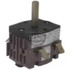 The La Cimbali 2 POSITION 16A GROUP SWITCH is a square black and purple rotary switch with a central metal shaft and four connectors, labeled and marked on the sides, designed for espresso machines and grinders. © 2025 1st-line.com