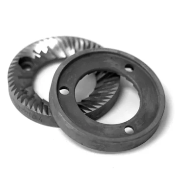 Two 58mm metal grinder plates with sharp ridges, partially overlapping, are shown on a white background. Designed for grinding, they are compatible with the Fiorenzato Flat Grinders Machine Plane - 58mm. © 2025 1st-line.com