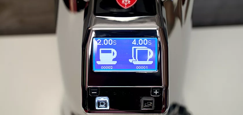 Close-up of an espresso machines display with cup icons and timers, plus/minus buttons—ideal for precise dialing in with a DISCONTINUED Eureka Zenith 65 E Espresso Coffee Grinder (Titanium Burrs, Short Bean Hopper). © 2025 1st-line.com