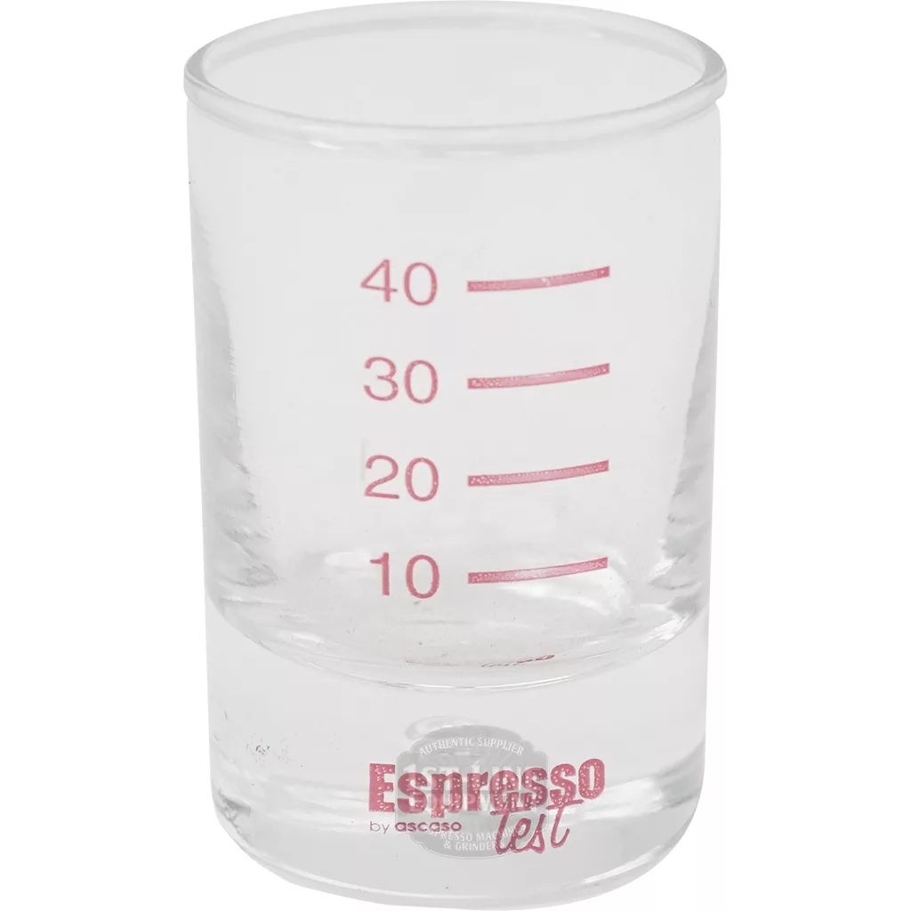 The V..855 ESPRESSO TEST GLASS is a clear measuring cup with red markings at 10, 20, 30, and 40 ml and Espresso Test labeled at the bottom. The empty glass is shown against a white background. © 2025 1st-line.com