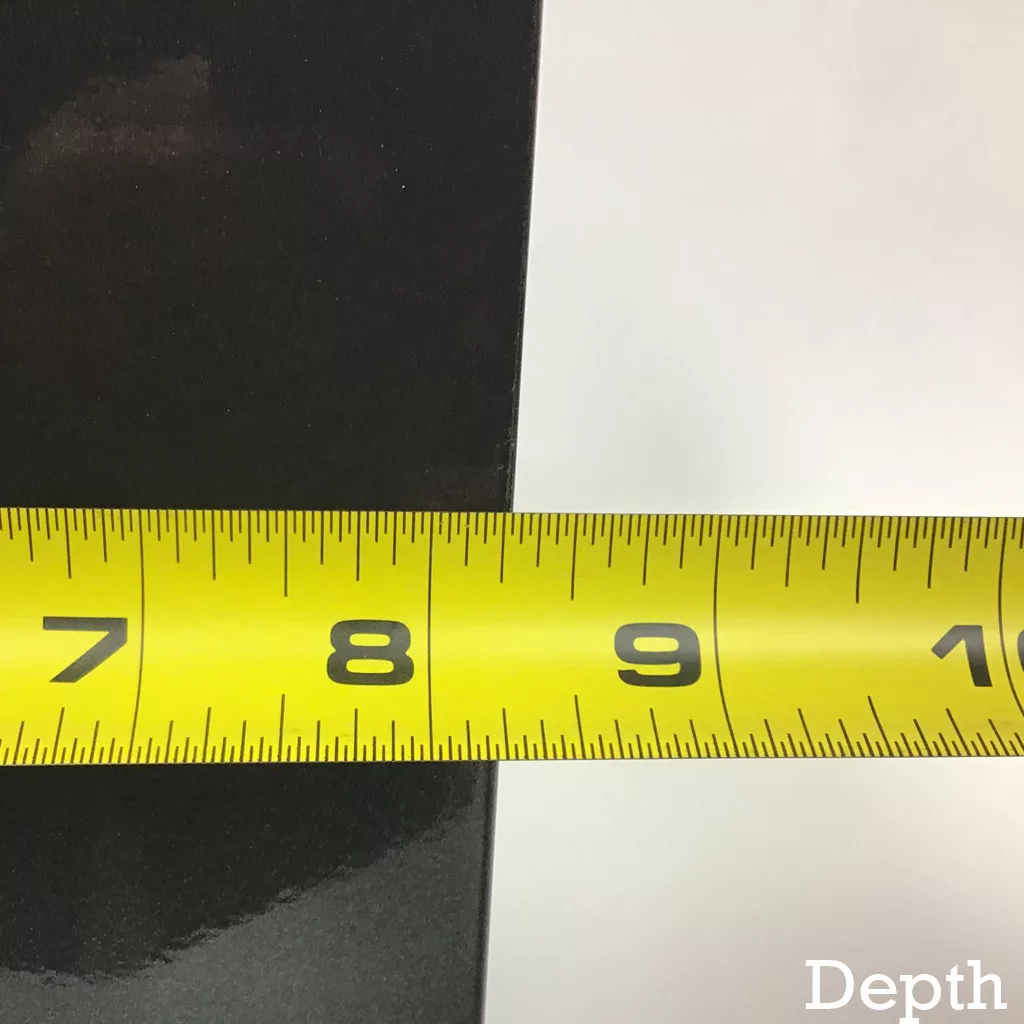 A yellow measuring tape stretches across the Olympia Anthracite Body Panel, showing a depth measurement of about 8.5 inches against a white background. Depth appears in the bottom right corner. © 2025 1st-line.com