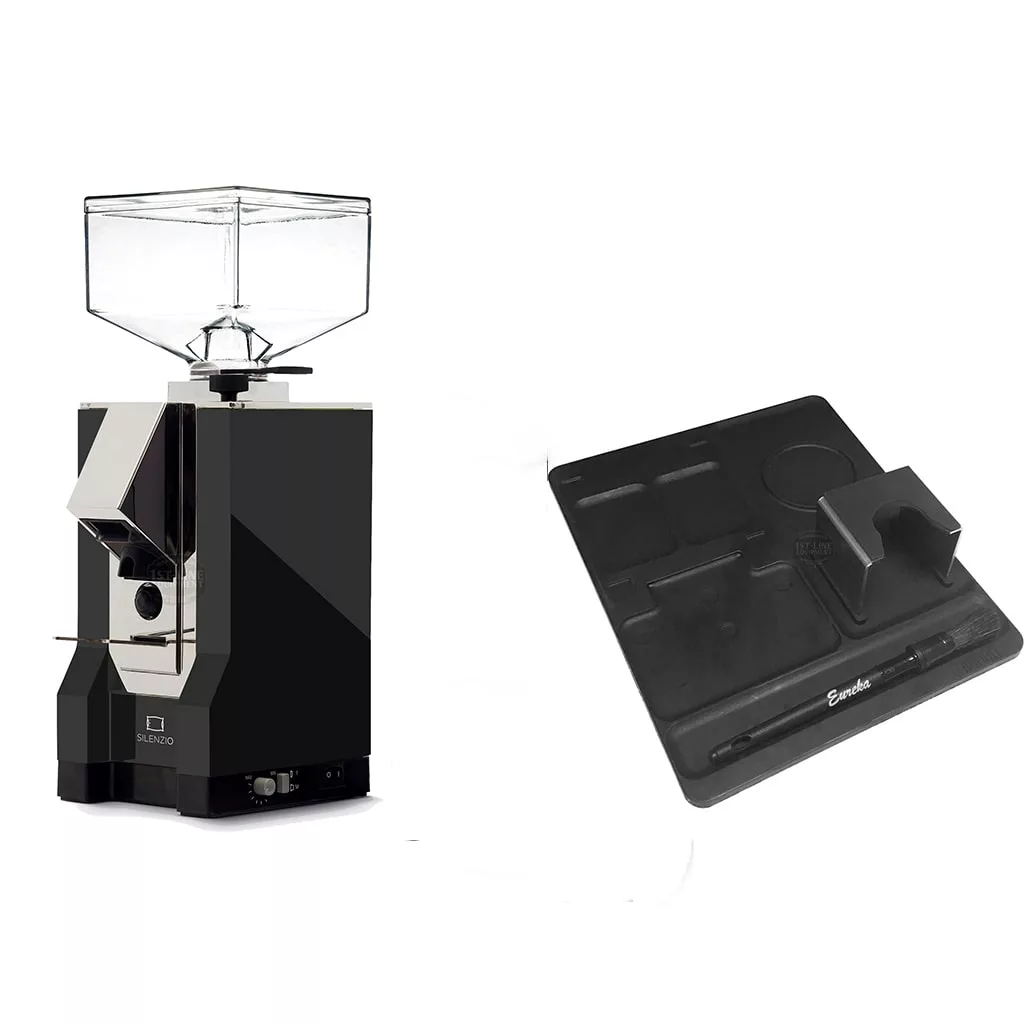 The Eureka Mignon Espresso Grinder Package Deal features a clear bean hopper grinder on the left and a black barista workstation mat with compartments and portafilter holder on the right, all set against a white background. © 2025 1st-line.com