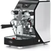 The VBM Junior Digital HX Espresso Machine w/ Flow Control showcases a stylish black and white design, chrome accents, dual handles, flow control, and a pressure gauge on a reflective drip tray featuring the VBM logo. © 2025 1st-line.com