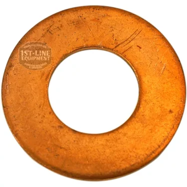 A flat, circular F..347 COPPER WASHER 24.5x12x1mm with a large central hole, bearing some scratches and a stamped 1st-Line Equipment logo on the upper left side. © 2025 1st-line.com
