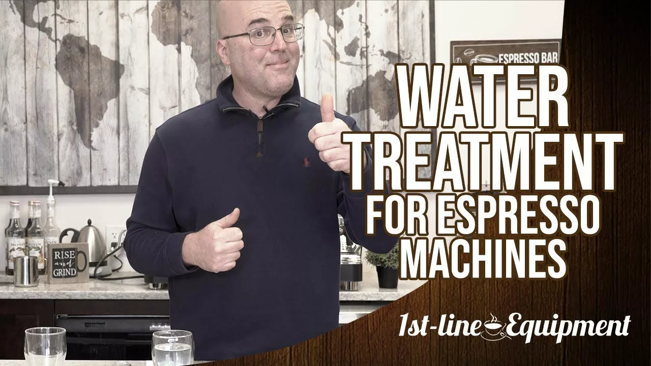 A man in a kitchen gives a thumbs-up next to the text Water Treatment for Espresso Machines and 1st-line Equipment. The background features a world map and coffee accessories. © 2025 1st-line.com