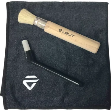 The Lelit PLA9101 Cleaning Kit features a wooden-handled brush and black cleaning tool on a dark gray microfiber cloth with white embroidered logo, ideal for keeping your espresso machine spotless. © 2025 1st-line.com
