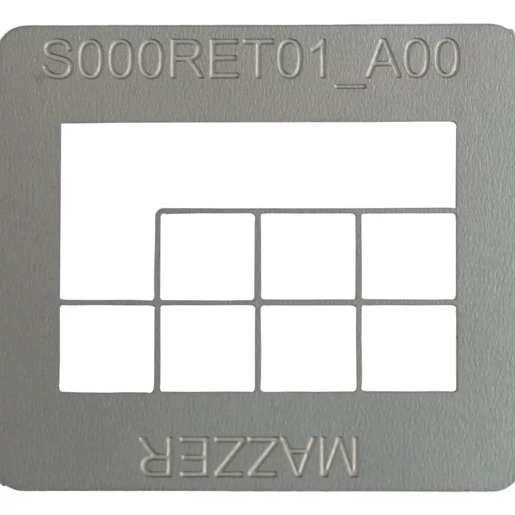 The Mazzer S000RET01/AQQ Grid is a metallic stencil labeled S000RET01 at the top and Mazzer at the bottom, with a large rectangular cutout above seven smaller grid-style rectangles in two rows. © 2025 1st-line.com
