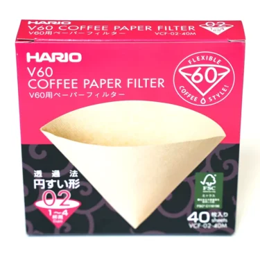 A box of SIDEWALK SALE-VBM White Junior WHITE Drip Tray, Grill & Water Tank Cover E209, with mainly white packaging and sleek design. Includes a drip tray, grill, and cover—perfect for your espresso machine setup. © 2025 1st-line.com