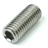 A close-up of a stainless steel DISCONTINUED ECM P1984A Foot Screw M10x25 shows its cylindrical threaded body and hexagonal socket end. © 2025 1st-line.com