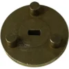 A worn brass tool with three cylindrical pegs and a central rectangular slot, designed for espresso machine maintenance tasks such as servicing the F..601 PUMP CONNECT FLANGE. © 2025 1st-line.com