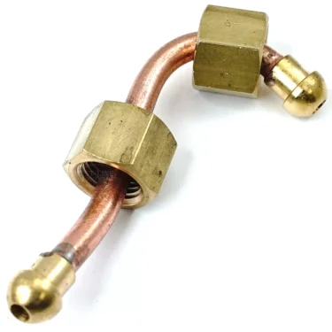 The ECM P1902 Steam Wand Extraction Pipe is a curved copper pipe with brass fittings and nuts on both ends, designed for ECM P1902 machines, ideal for plumbing or mechanical connections, shown isolated on a white background. © 2025 1st-line.com