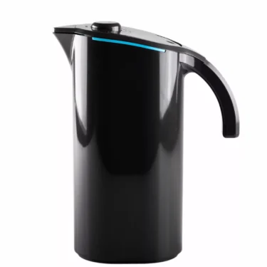 The Peak Water Softener Pitcher Starter Pack, featuring a modern black pitcher with a curved handle and blue accent near the lid, is displayed against a white background. © 2025 1st-line.com
