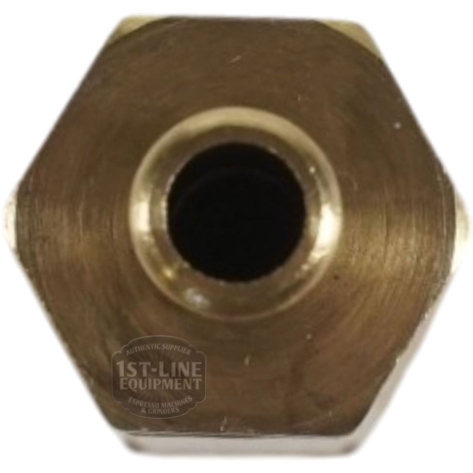 Close-up view of a brass hexagonal fitting adapter with a central circular opening, similar to the Lelit 9700043 Safety Valve - 5.5 Bar 1/8G, commonly used in plumbing or espresso machines. © 2025 1st-line.com