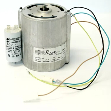 An Elektra 06584035 115V Motor with colored wires is next to a white 6.3 μF capacitor, both on a white background. The motor’s label shows its specifications and RPM. © 2025 1st-line.com