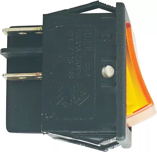 Close-up of a Futurmat 250V 16A ORANGE BIPOLAR SWITCH with yellow-orange translucent actuator and visible metal prongs for electrical connections—commonly used in Futurmat equipment. © 2025 1st-line.com