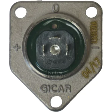 Close-up of a Gicar 9.0.16.50G 3 Connection Cover for Volumetric Flowmeter, showing two screw holes, a black circular center, and markings including GICAR, +, -, and 04/17. © 2025 1st-line.com