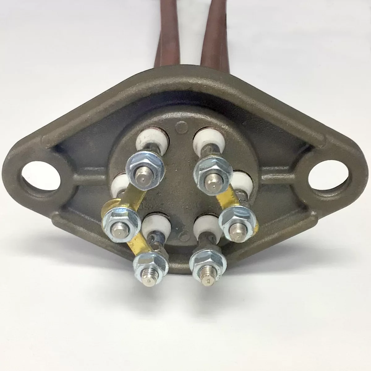 A close-up of the Wega W22002 3400W 110V Heating Element metal base features six connection terminals with nuts and washers and two mounting holes on each side, ideal for 110V, 3400W heating element setups. © 2025 1st-line.com